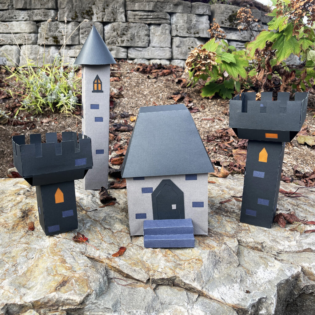 Full 3D paper castle set including gatehouse battlements and tower displayed outdoors