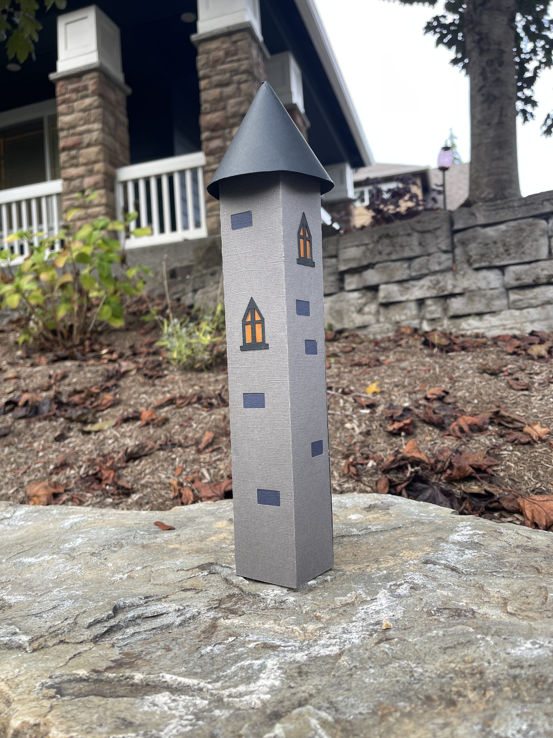 Finished 3D paper tower representing a crafting project repaired after a mistake.