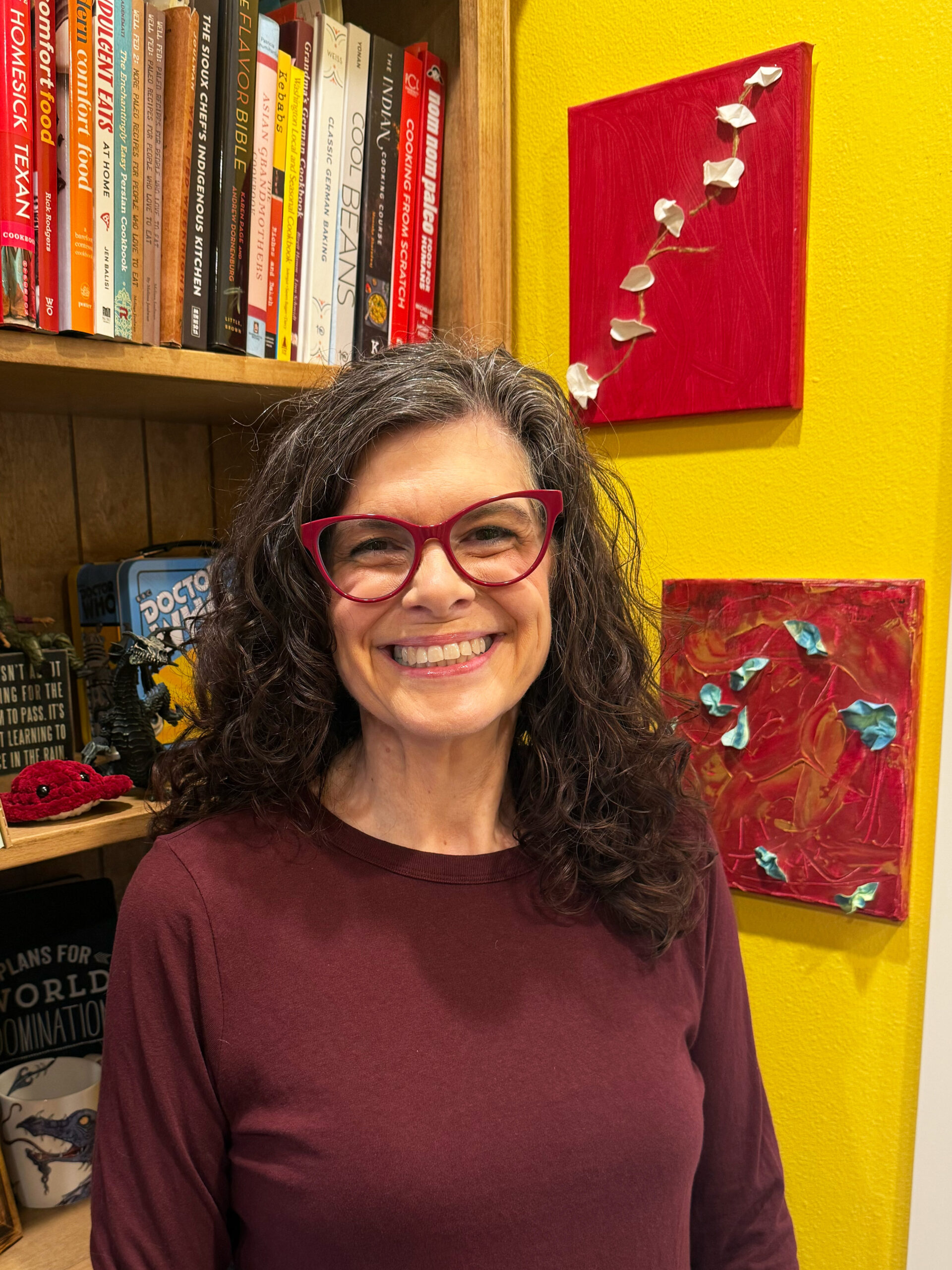 Me standing in my office on what would have been Molly’s 45th birthday, with the two Paint & Whine paintings displayed on my office wall behind me.