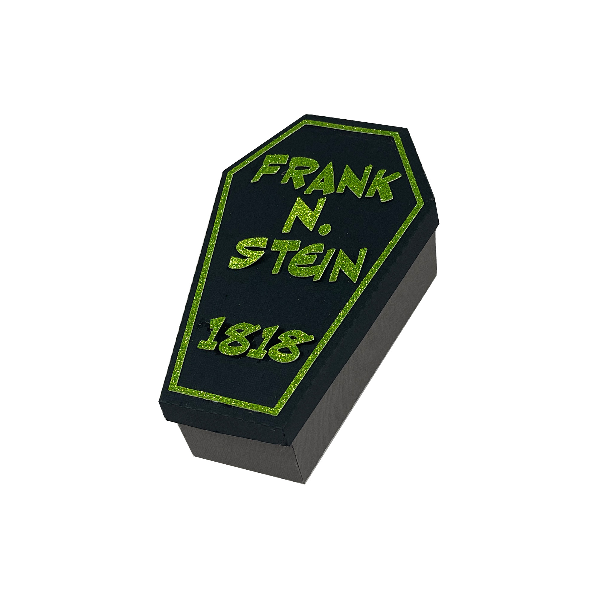 The finished Six-Sided Coffin Box: a black paper coffin with its lid on, lettered in green vinyl with the name Frank N. Stein and the year 1818.